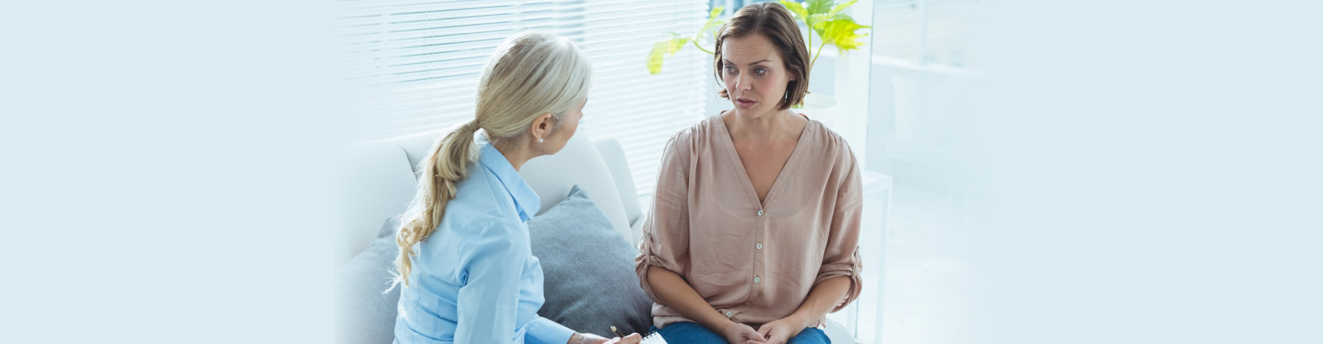 Upset woman talking to therapist