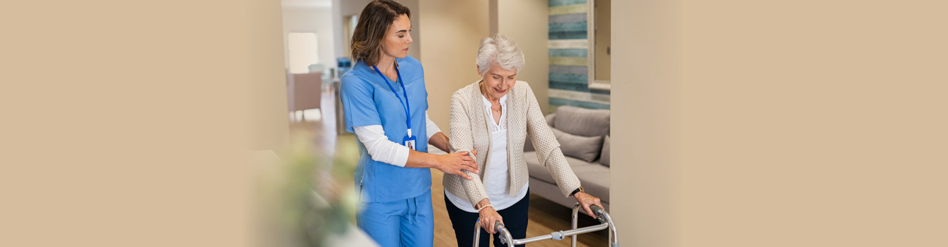 Nurse helping senior woman to walk at private clinic