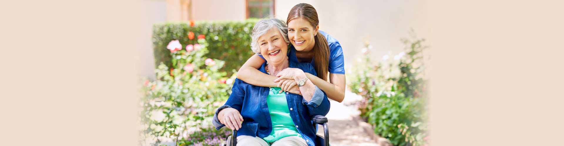 Shot of a resident and a nurse outside in the retirement home garden.