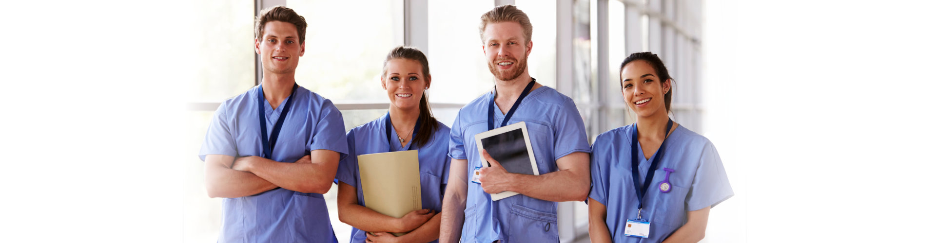 group portrait of healthcare workers in hospital corridor